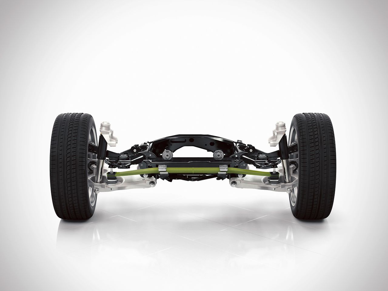 The rear axle of the new Volvo XC90 features a new transverse leaf spring, made of lightweight composite material. 